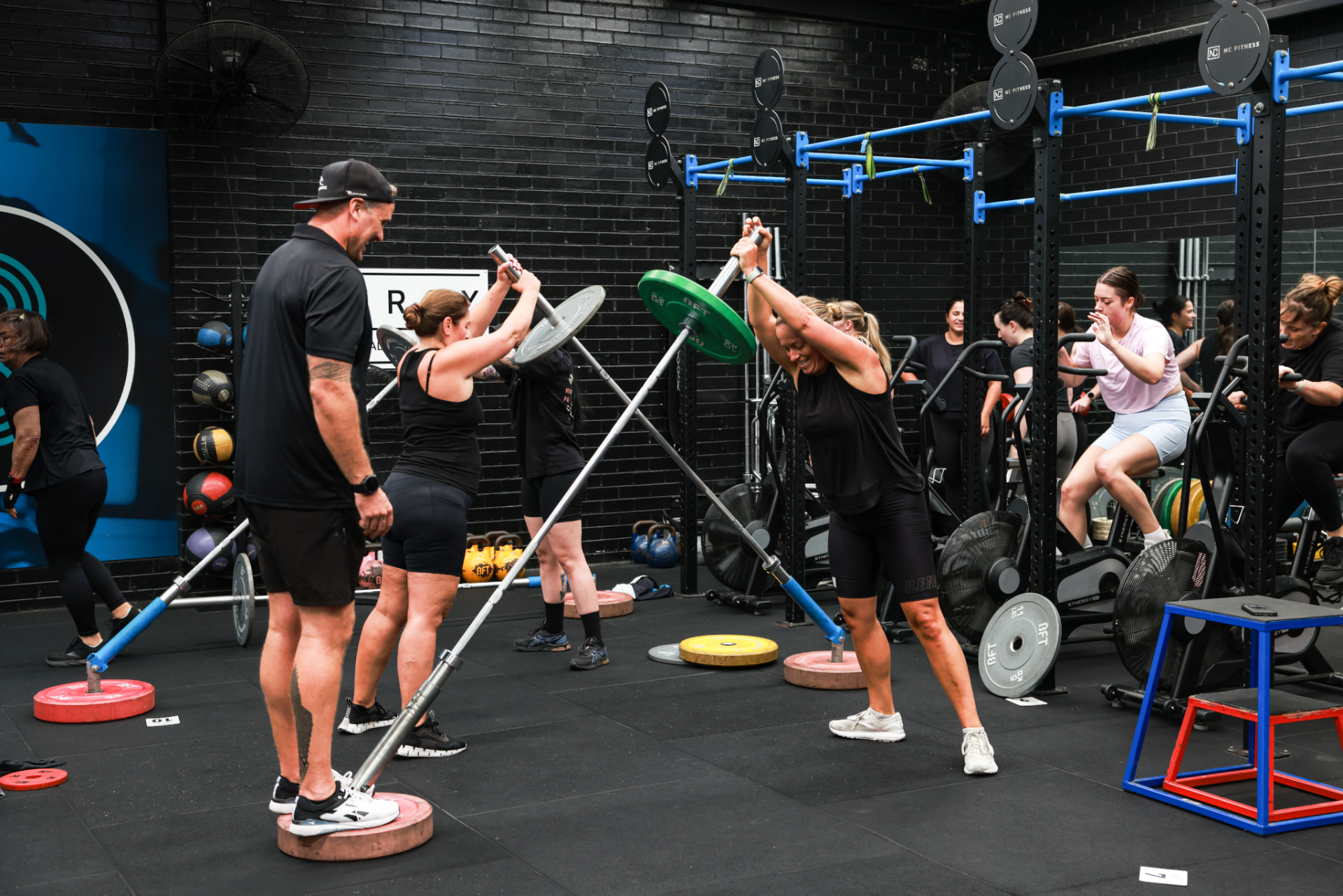 A coach setting up a member on the rack at BFT Abbotsford